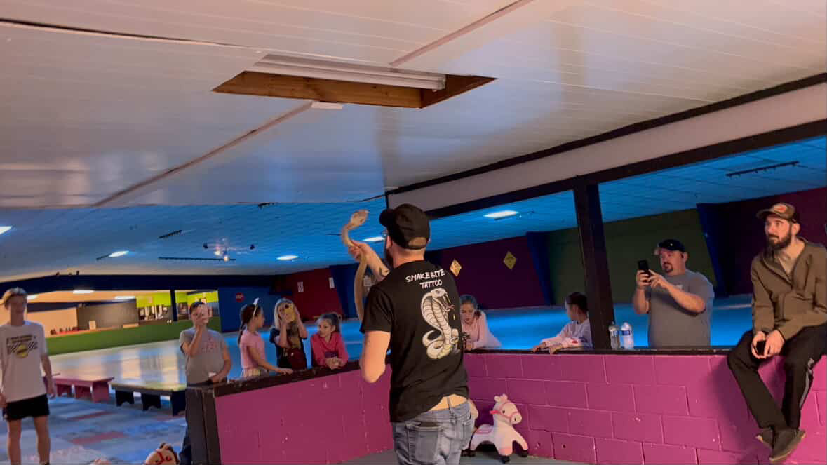 Joey demostrating Lilith the cobra.